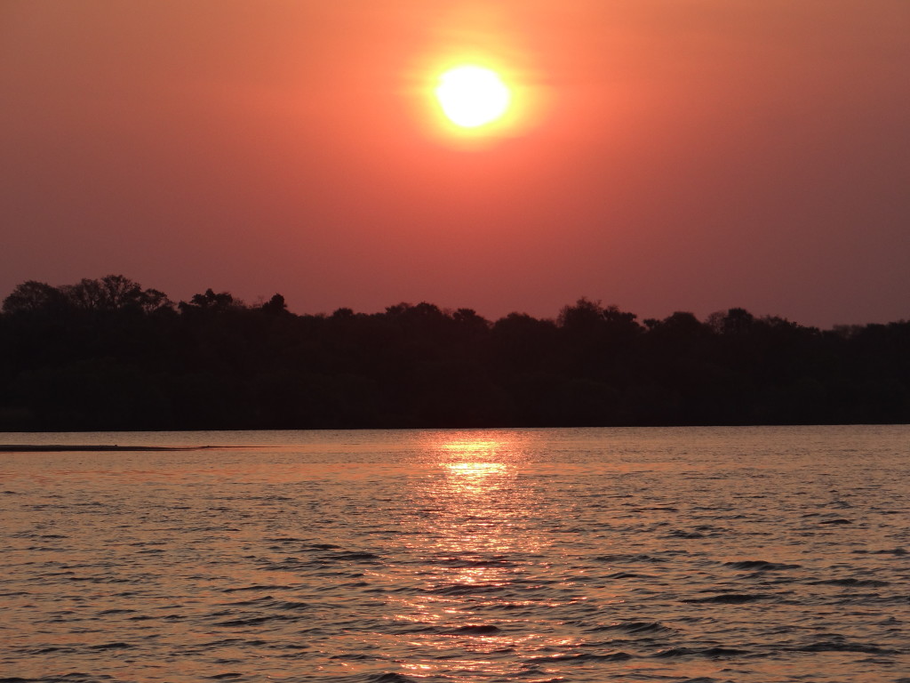 African sunset over water