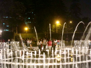 Group fun inside the fountain - who will remain dry?