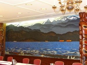 Carved wood totems and mural in meeting room