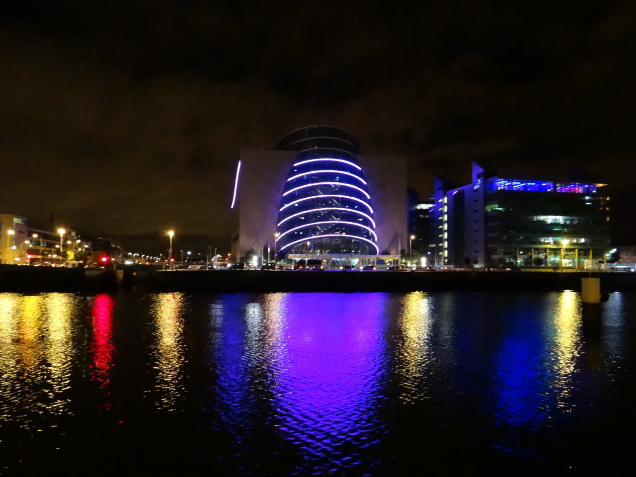 Dublin at Night - Convention Center colors reflected on the Liffey River