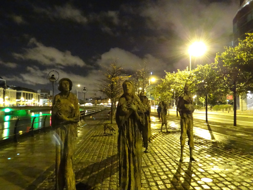 "The Famine" installation at night along the River Liffey in Dublin