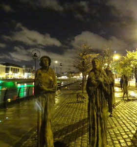 "The Famine" installation at night along the River Liffey in Dublin