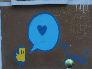 Paris street art - bird chiping love