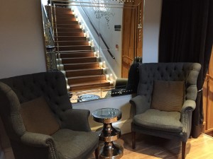 Private seating area across from stairs to the first floor Plum & Spilt Milk at the Great Northern Hotel London