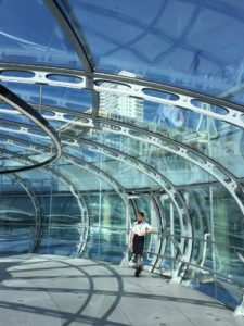 BA staff on i360 posing against the glass interior pod