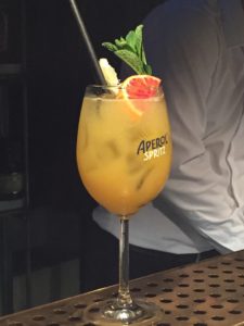 Orange cocktail with fruit garnish at O ver Italian Restaurant Bankside
