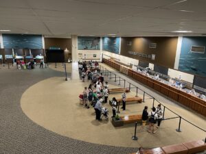 View from above of the early and mostly empty Hawaii cruise port check in for Royal Caribbean