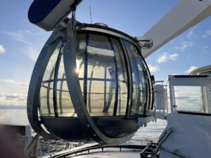 North Star Observation Pod with sunset behind. the circular pod in metal is part of the larger arm to rise above the ship