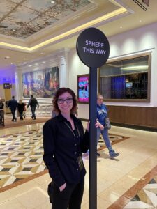 Young woman in glasses holding sign in the Venetian Hotel Las Vegas