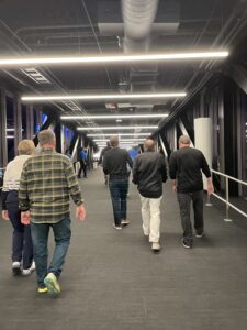 Men walking in corridor