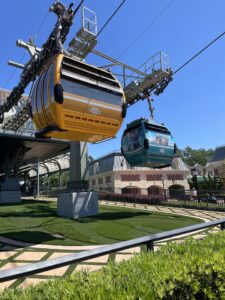 Skyliner gondolas at Epcot in yellow and green