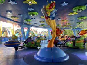 Bright colored stars and ride cars on the Alien Swirling Saucers at Toystoryland