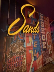 Sands Neon Sign at Mob Museum against casino name display