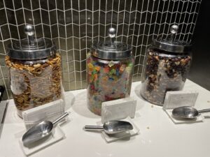 Three candy jars of sweets in the United Polaris lounge at Newark